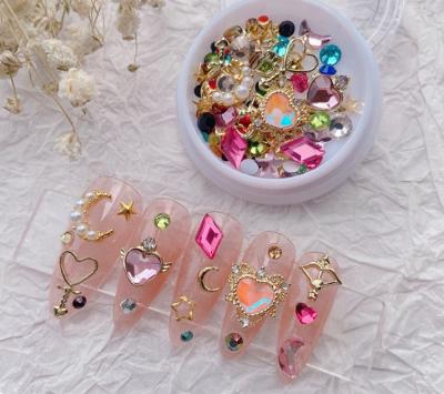 China Fashionable Low Price Zircon Nail Charms Kawaii Designs Crystal Rhinestones Alloy Studs Star Moon Love Nail Charm Set for sale