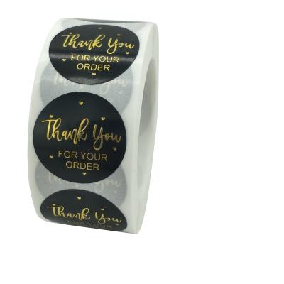 China Waterproof Round Shape Black Coated Paper Gold Foil Stamping Thank You Handmade Sticker Seal Label for sale