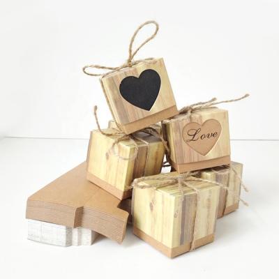 China Retro Handmade Sweet Square Hollow Love Heart Kraft Paper Candy Packaging Box for sale