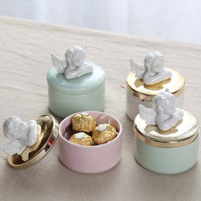 China Ceramic Golden Chocolate Ring Storage Display Box Candy Box Angel Cartoon Cupid Ceramic Jewelry for sale