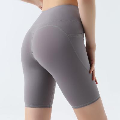 China Breathable Women Workout Fitness Sports High Waisted Yoga Shorts With Side Pockets for sale