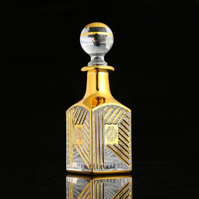 China CJ-Luxury High Quality Recyclable UV Gold Printing Decorative Vintage 150ML Perfume Bottle Essential Oil Glass Empty Bottle For Oud for sale