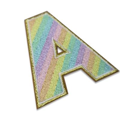 China Viable Free Sample Custom Designer Gold Glitter Iron On Patches Letter Embroidery Adhesive Patches for sale