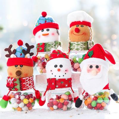 China Festival Decoration Selection Factory Price Santa Snowman Plush Decoration Mini Bottle Christmas Candy Plastic Decorative Bottle Jar for sale