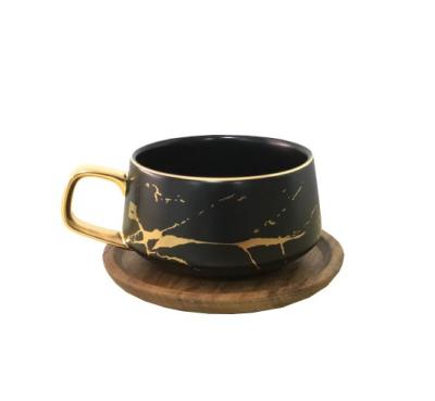 China Viable Gold Matte Black And White Pattern Coffee Tea Mug Marble Ceramic Coffee Mug With Wooden Coaster for sale