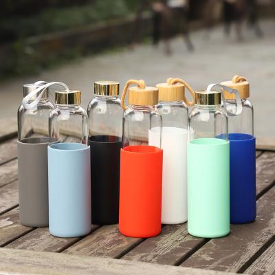 China PORTABLE High Quality 550ml Borosilicate Bamboo Lid Glass Water Bottle With Silicone Sleeve for sale