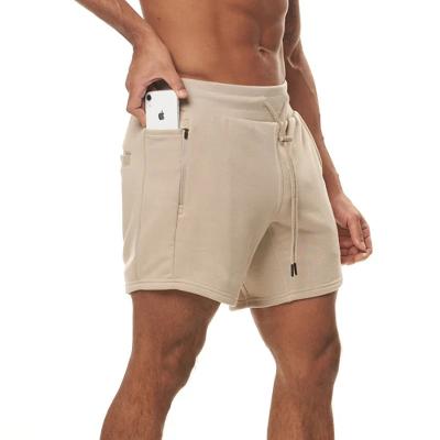 China Anti-Wrinkle Sports Gym Abbreviations Mens Shorts Running Sports Fitness Pants With Side Pockets Shaping Cotton Shorts for sale