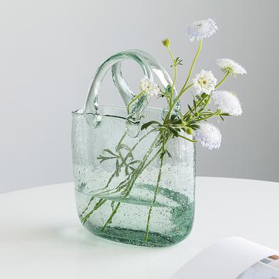 China New Arrival Minimalist Crystal Glass Flower Vase Handbag Amazon Wedding Centerpieces Home Decors Ornaments for sale