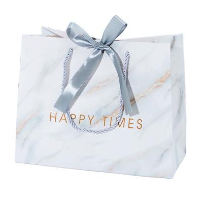 China Creative Marble Printed White Paper Recyclable Wholesale Apparel Gift Shopping Bags for sale