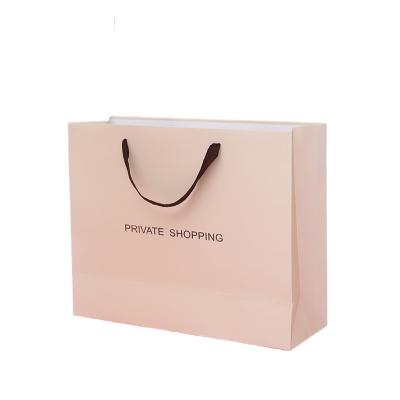 China Paper Bag Logo Luxury Brand Shopping Boutique Recyclable Garment Packaging Recycle Bolsa De Papel Pape Bags With Handle for sale