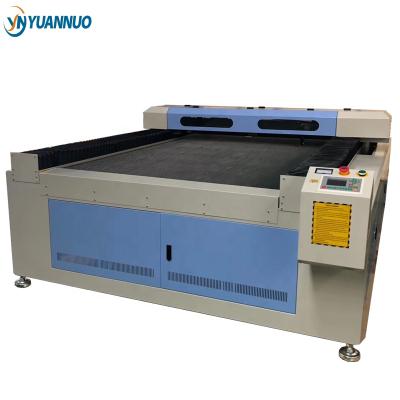 China YN1325 YN1530 programmable CO2 laser cutting machine for sale for fabric acrylic wood rubber die board bamboo for sale