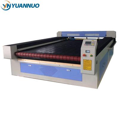 China Laser CUTTING YN1630 Automatic Computer Feeding Laser Cutting Machine for Fabric or Leather or Rubber or Textile or Cloth for sale