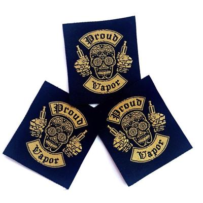 China Viable Hot Sale New Product Customized Skull Logo Garment Accessories Gold Satin Woven Labels For Clothes Hat Shoes for sale