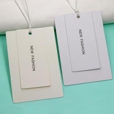 China Viable Cheap Custom Printing Clothing Hang Tags Logo Paper Garment Hangtag Labels Manufacturer Free Design FSC Name With String for sale