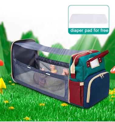 China Multi-Functional Diaper Bag Portable Waterproof Foldable Baby Purpose USB Hutches Push Up Baby Backpack with Bed and Sunscreen Cloth for sale