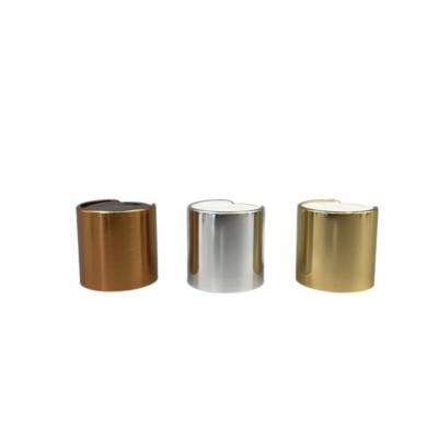 China Aluminum Disc Top Flip Cap Top Dispensing Gold 24/410 Metallized Surface for sale