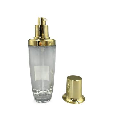 China 100ml Transparent Oval Cosmetic Bottle Gold Cap Lotion Customized Color for sale