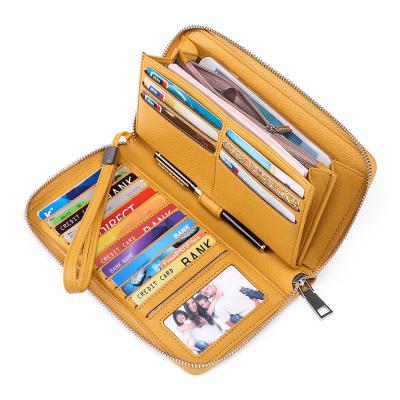 China 2022 European Fashion Long Zipper Leather Women's Youth Business Cattle Wallet Wallet Clutch Bag Men's Phone Bag for sale