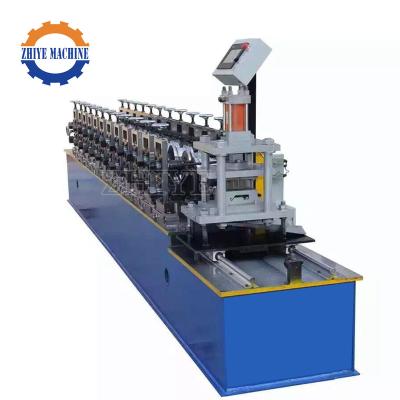 China PLC Automatic High Quality Galvanized Sheet Metal Roller Shutter Door Roll Forming Machine for sale