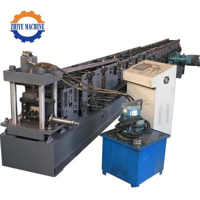 China Shelf baffle roll forming machine sheet metal cutting and bending steel stud support shelf cold roll forming machine price en venta