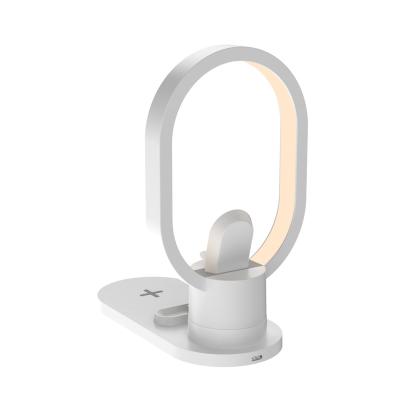 China 2022 Multifunctional New X3 Desktop Table Lamp Fast Charging Station 4 in 1 Wireless Charger for Phone Watch Earphones for sale