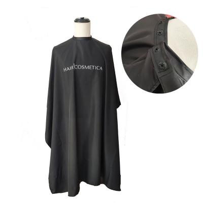 China Barbershop Factory Price Black Color Logo Haircutting Cape 160x140cm Silver Printing Barber Capes for sale