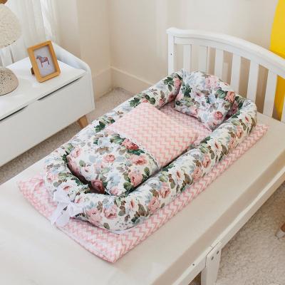 China Modern High Quality Customized Floral Design Baby Nest Baby Crib Portable Bed for sale