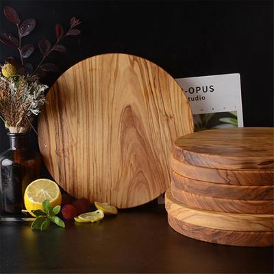 China Real Sustainable Natural Round Shape Fruit Cake Bread Meat Serving Cutting Olive Wood Cutting Board for sale