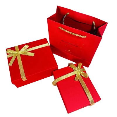 China Recyclable Eco-Friendly Red Cardboard Gift Packaging Box With Bags Ribbon For Jewelry Gifts Skin Care Cosmetics Boxes for sale