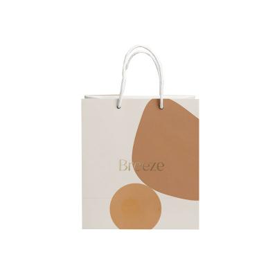 China Recyclable Custom Logo Clothing Shopping Bag Gift Packaging White Kraft Paper Bag With Rope Handle For Cosmetics for sale