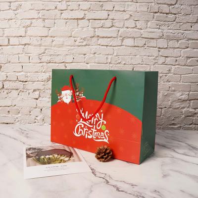 China Whosale Recyclable Boutique Printing Custom Logo Christmas Shopping Paper Gift Bag With Ribbon Handle for sale