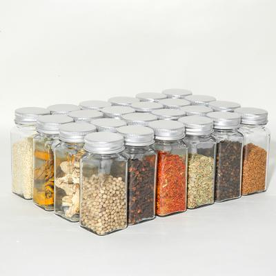 China Sustainable Kitchen Tools Grill Morden Square 120ml Unbreakable Glass Spice Jars With Silver Metal Lids for sale