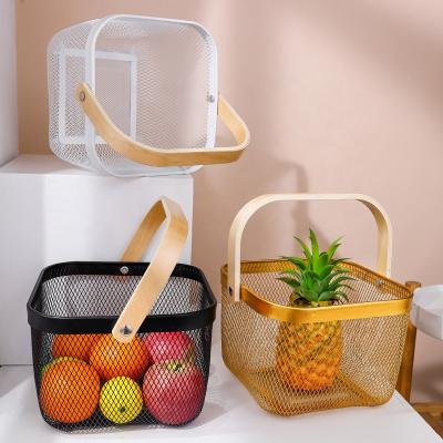 China Sustainable Universal Gold Plated Hanging Storage Baskets Metal Mesh Kitchen Storage Basket With Wood Handle for sale