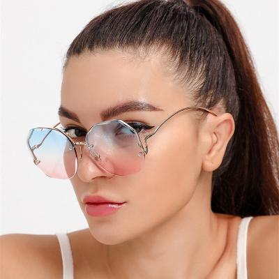 China Fashion Sunglasses 2021 New Hot Selling Women Shape Sunglasses Rimless Metal Frame Trendy Cool Square Sunglasses for sale