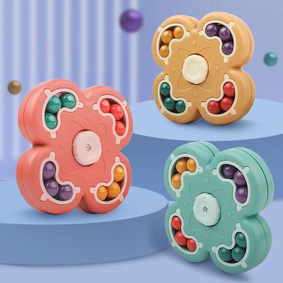 China Spinning Bean Disc Anxiety Relief Fidget Spinning Magic Toys Effort Release Moving Person Ball Double Sided Magic Finger Top Cube Toy Puzzle For Kids for sale