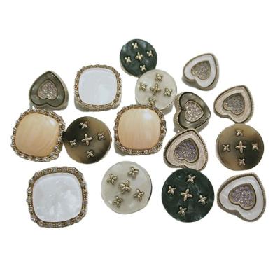 China Custom Washable High Quality Fancy Heart Fabric Design Gold Metal Pearl Rhinestone Leg Metal Leg Button for Coat Clothing for sale