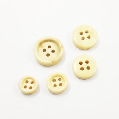 China Hot stock 10mm-25mm style dry cleaning sale logo free engraved wooden buttons shirt classic natural nickel color for sale