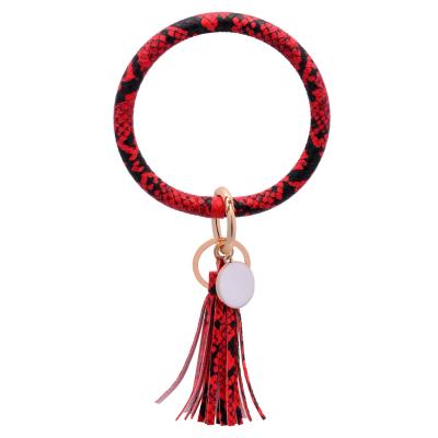 China Plush PU Leather Wristband Chain Bracelet Big O Key Chain Bracelet Buckle Silicone Wristband With Tassel Hand Chain Bracelet For Women for sale