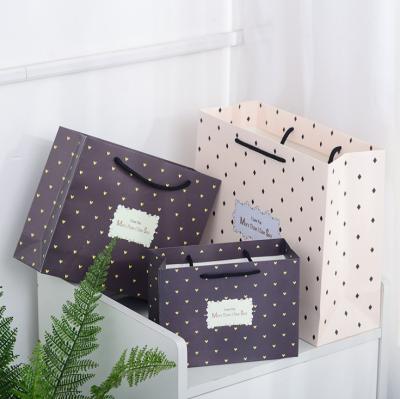 China Recycled Materials Simple Fresh Pure Color Bottom Dot Love Gift Paper Bag Large, Medium And Small Gift Bag for sale