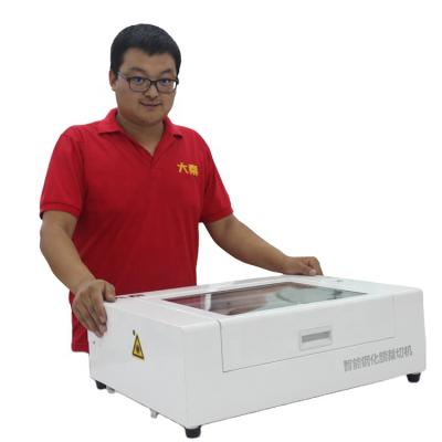 China Daqin Mobile Phone Screen Protector Automatic Cutting System Nano Glass Film Laser Cutter Machine With Software for sale