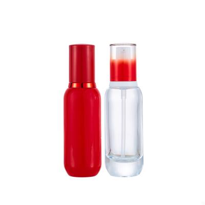 China 2021 New Design Serum Pump Bottle Luxury Red Glass Cosmetic Skin Care Packaging for sale