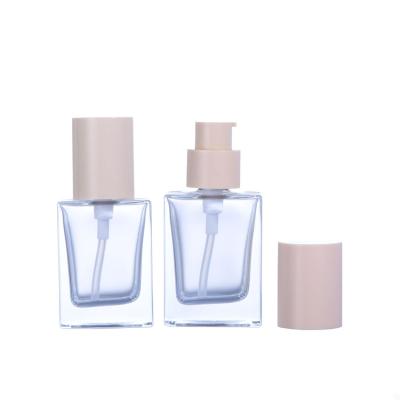 China Wholesale Empty Personal Care Square 30ml Clear Makeup Foundation Bottles Cosmetic Packaging With Pink Pump for sale