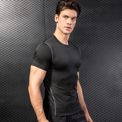 China QUICK DRY Polyester Shirts Gym Muscle Compression T-shirt Men Fitness Workout Wear T-Shirts for sale