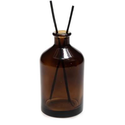 China Modern Popular Design Round Empty Cylinder Diffuser Bottles Amber Glass Bottle With Rattan Sticks for sale