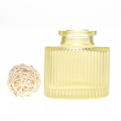 China Hot Sale OEM 30ml Emboosed Luxury Yellow Round Reed Diffuser Glass Bottle for sale