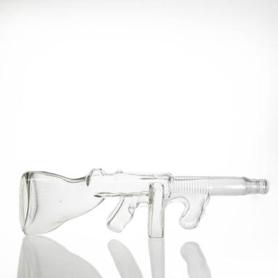 China Thomson 750ml Modern Unique Clear Gun Bottle Glass Wine Bottle With Cork for sale