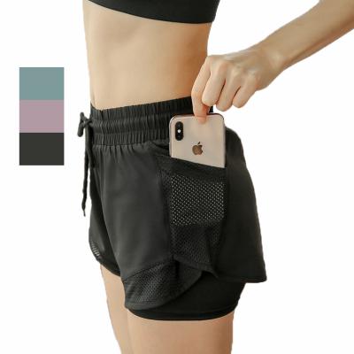 China Custom Breathable Yoga Wear Women Summer Loose Quick Dry Athletic Sports Fitness Shorts With Pockets for sale