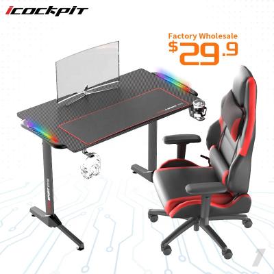 China Innovative Expandable Home Office Ergonomic Gaming Table Flashing With Music RGB Lighting Led Gaming Desktop PC Desk for sale