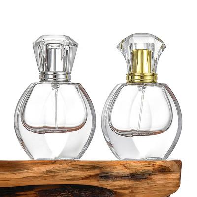 China Cosmetic Ru Star Elegant Custom Logo Thick Base 30ml Round Flask Perfume Glass Sprayer Bottle With Glass Cap for sale