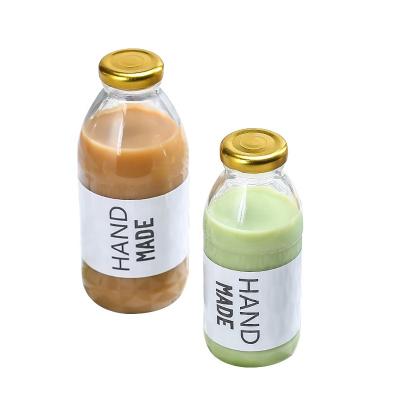 China Beverage Ru Star  New Wholesale Empty Round 250ml 300ml 500ml Glass Beverage Screw Bottle For Milk Tea Coffee Juice Packaging for sale